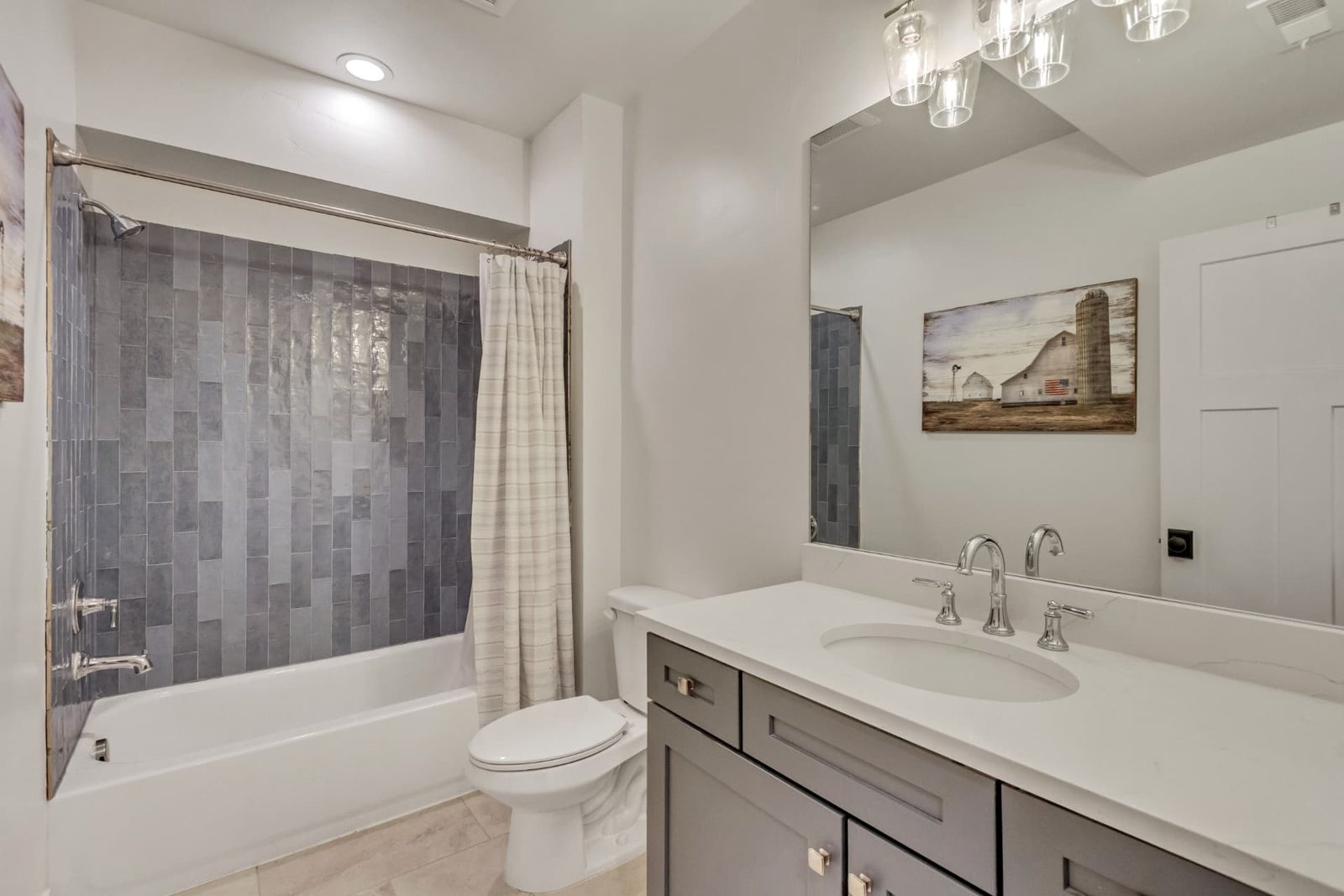 Finished basement bathroom with tiled tub surround — Bountiful, Utah