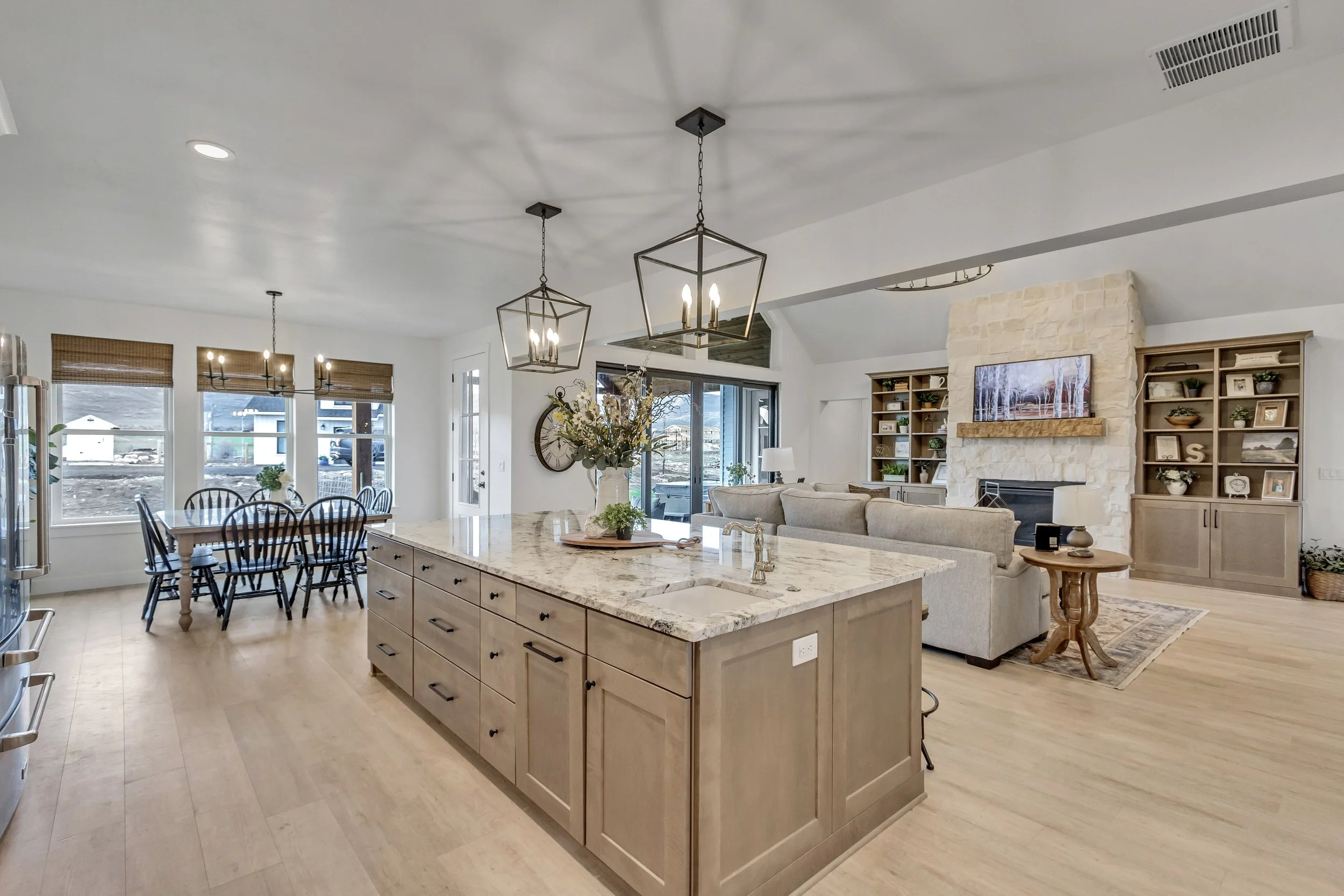Open-concept custom great room and kitchen built by Outlook Builders